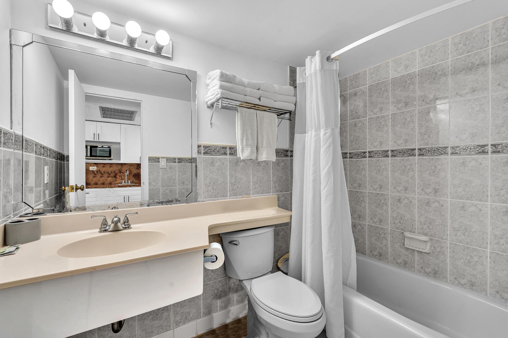 Studio Retreat with Balcony and Partial Ocean View- 424