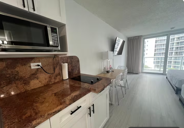 Studio Retreat with Balcony and Partial Ocean View- 424