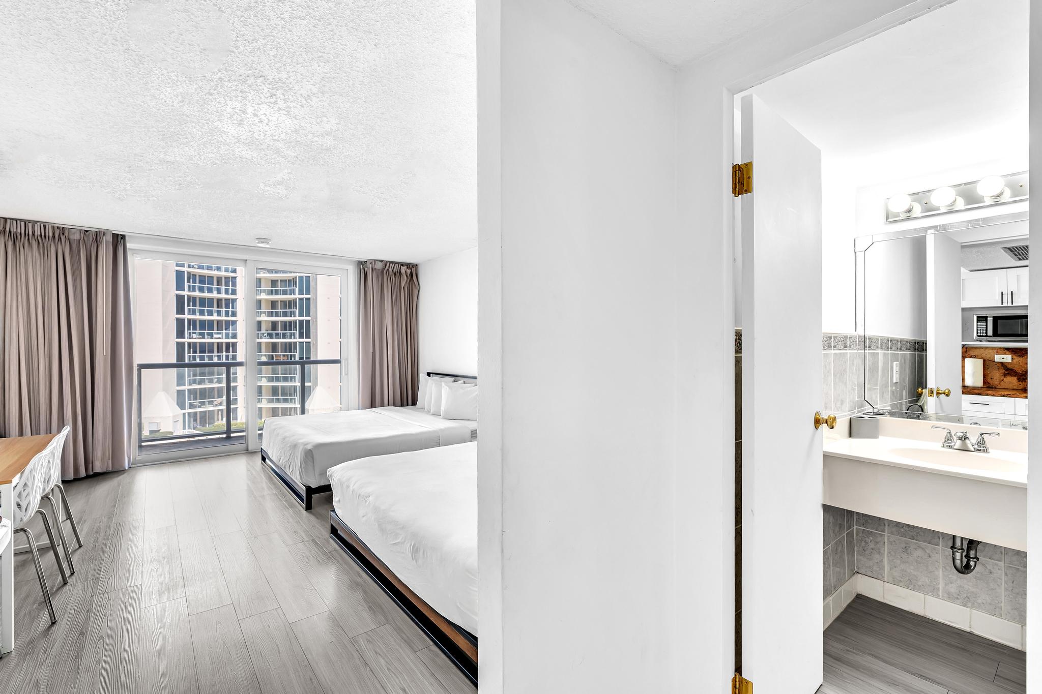 Studio Retreat with Balcony and Partial Ocean View- 424