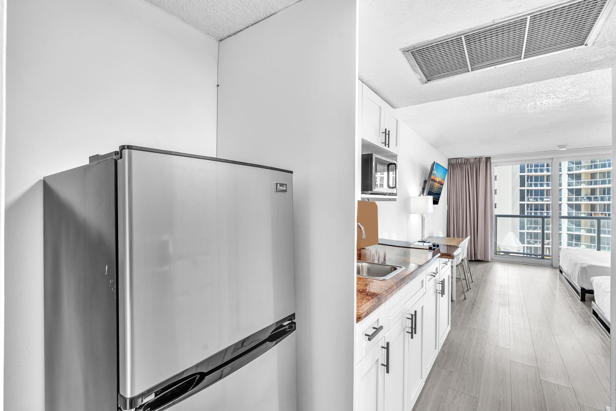 Studio Retreat with Balcony and Partial Ocean View- 424